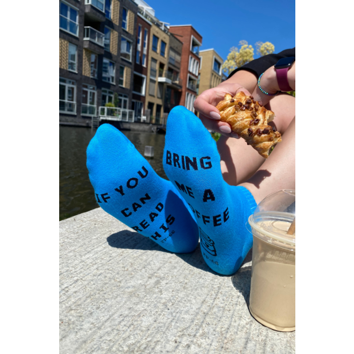 Blue socks with text "If you can read this, bring me a coffee".