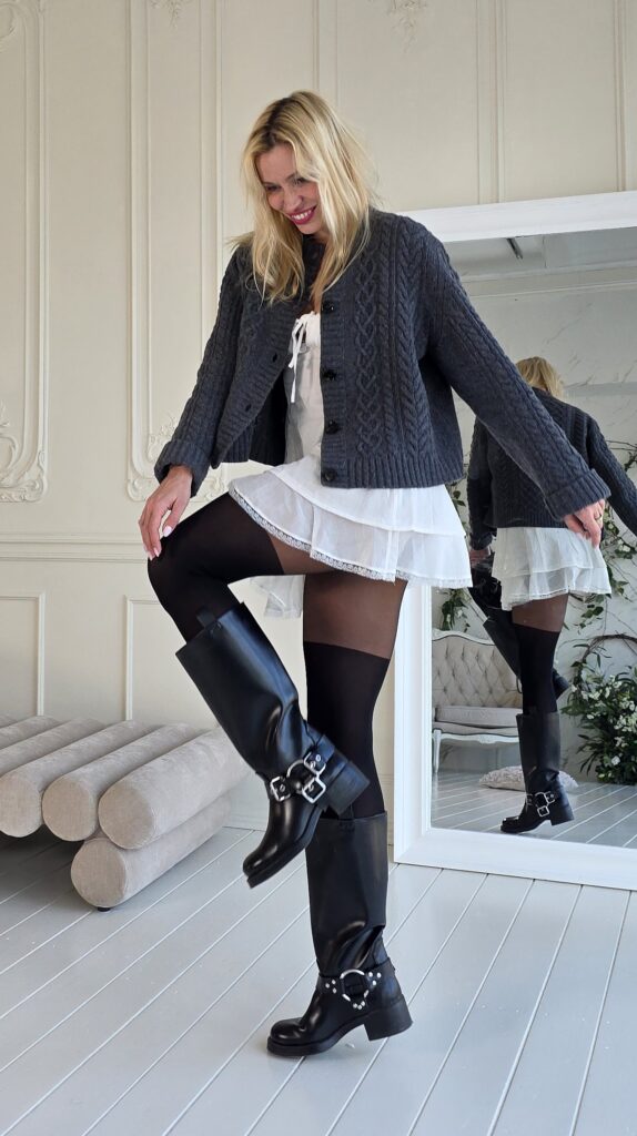 Woman standing and showing off her new tights