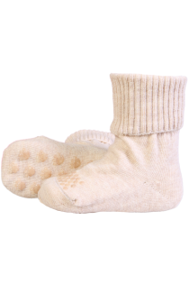 Beige cotton socks for babies with non-slip pads.