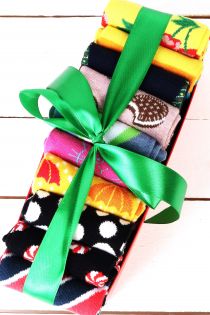 Bundle of women's socks, 10 pairs, various colorful patterns, tied with a green ribbon.