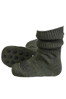 Green woolen baby socks with non-slip black dots on the bottom.