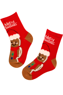 Red children's Christmas socks featuring a gingerbread man and 'Merry Christmas' text.