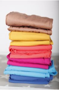 Image of a stack of various colored tights. The tights are layered on top of one another, visible in shades of beige, yellow, orange, pink, blue, and light blue.