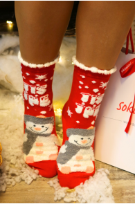 Red Christmas socks with a snowman and snowflake pattern, adorned with a white furry trim.