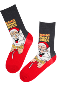 Men's knee-high socks with a black shaft, featuring red base with a cartoon-style Santa Claus playing video games and the phrase 'HANG GAME OVER'.