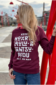 Women's purple sweatshirt featuring the text 'PÜHA ON MAA', with long sleeves and a round neckline.