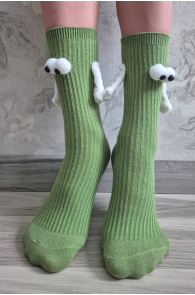 Green children's socks with magnetic paws and eyes.