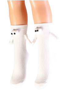 White children's socks with magnetic hands, featuring small eyes and whiskers for a playful appearance.