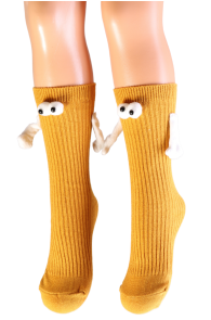 Yellow children's socks with magnet paws, visible soft eye attachments on the cuffs.
