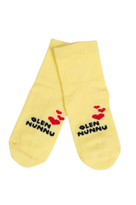 Yellow cotton socks for babies, with 'OLEN NUNNU' text and red hearts.