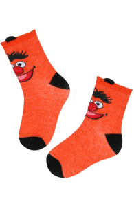 Orange cotton socks for kids featuring a character's face, with black heels and toes.