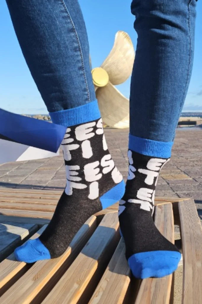 Socks in colors of the Estonian flag and writing "Estonia".