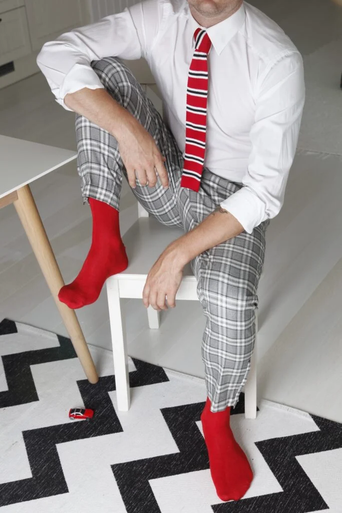 red TAUNO socks with a matching red knitted tie
